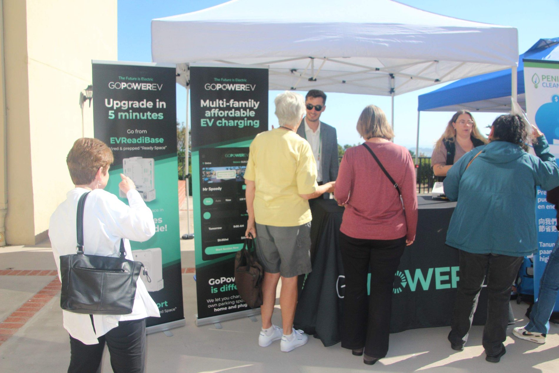 The GoPower team with residents at a community event