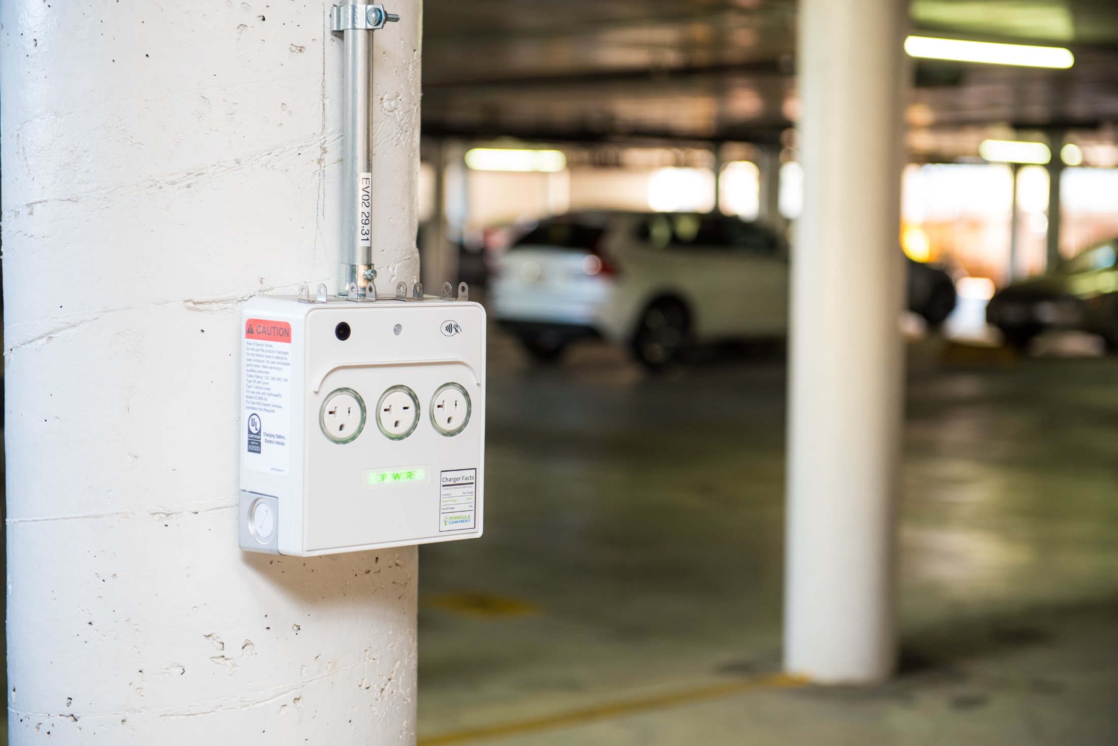A GoPower PowerPort3 mounted on a parking-structure column in a resident garage