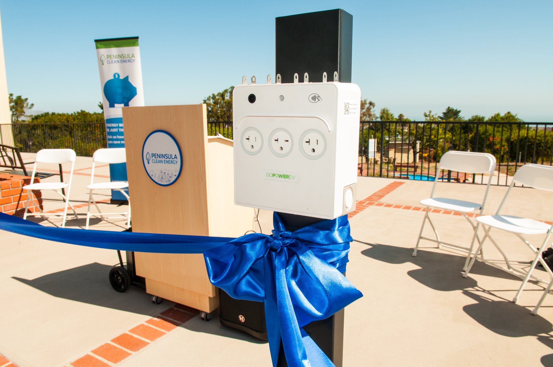 A GoPower PowerPort3 with a ribbon tied around it at a project ribbon-cutting event